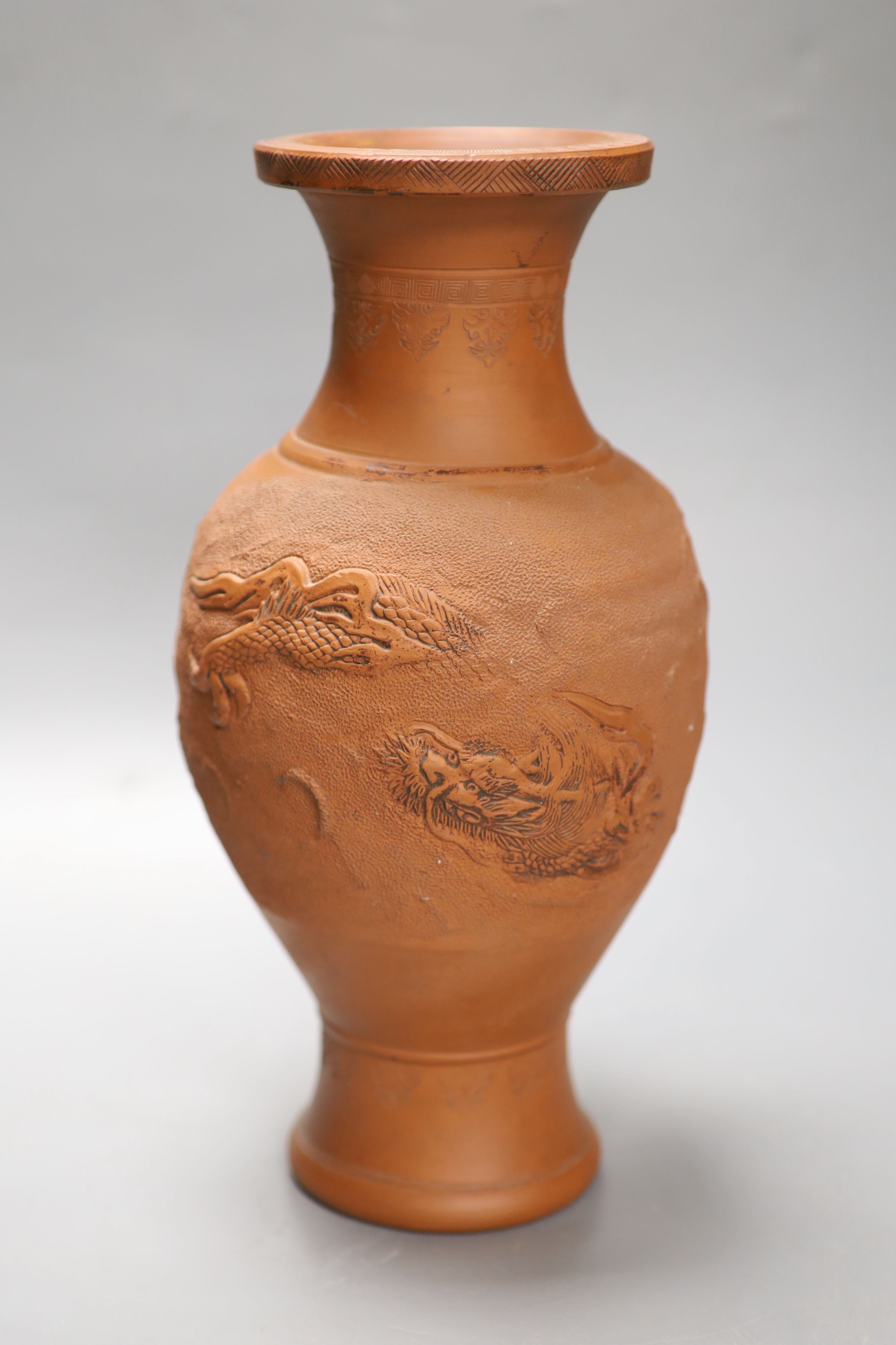 A Chinese terracotta dragon vase, height 31cm